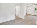 Spacious living area with wood-look flooring and pristine white walls, offering versatility at 1420 Tyler St, Kannapolis, NC 28083