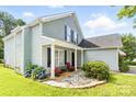 The exterior features a cozy porch area, perfect for enjoying the outdoors, with an American flag visible at 1515 Kingdom Way, Fort Mill, SC 29707