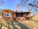Charming single-story brick home with a covered front porch at 176 Travis Loop, Statesville, NC 28625