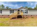 Beautiful gray single-Gathering home with new natural wood porch at 2007 Sugar Hill Rd, York, SC 29745