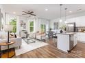 Open concept living area with hardwood floors, ample natural light, and stylish modern furniture at 2723 Capitol Dr, Charlotte, NC 28208