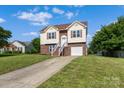 Well-maintained home with front lawn, driveway and brick and siding exterior at 4111 Alexis Sw Ct, Concord, NC 28027