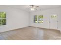 Bright living room with wood-look floors, natural light, and neutral paint for an open and airy feel at 5175 Grand Canyon Rd, Concord, NC 28027