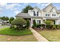 Inviting townhome with a well-maintained lawn and pathway to the front door at 6103 Warrior Ave, Fort Mill, SC 29707