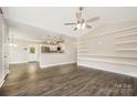 Bright and airy living room boasting vaulted ceilings, wood floors, and custom shelving at 613 Gold Hill Dr, Salisbury, NC 28146