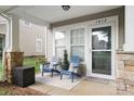 Cozy front porch with seating and decorative details at 1012 at 1012 Laparc Ln, Indian Trail, NC 28079