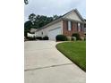 Home with a spacious driveway leading to an attached two-car garage at 2300 Wednesbury Ct, Kannapolis, NC 28083