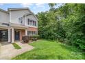 Inviting two-story townhouse with green lawn and natural backdrop at 3561 Calpella Ct, Charlotte, NC 28262