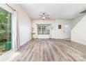 Bright and airy living room with new hardwood floors, ceiling fan and natural light at 3561 Calpella Ct, Charlotte, NC 28262