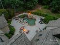 Overhead view of the backyard, showing the custom pool, fire pit, and meticulously designed outdoor space at 3587 Ridgetop Rd, Sherrills Ford, NC 28673