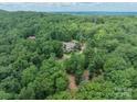 Estate aerial view surrounded by mature trees on a large lot providing privacy and a serene setting at 3587 Ridgetop Rd, Sherrills Ford, NC 28673