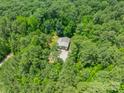 Aerial view of a detached two-car garage surrounded by mature trees on a large lot at 3587 Ridgetop Rd, Sherrills Ford, NC 28673