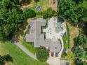 Aerial view of custom home featuring an inground pool, jacuzzi, patio and lush landscaping at 3587 Ridgetop Rd, Sherrills Ford, NC 28673