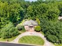 Aerial view of an elegant home surrounded by lush greenery, showcasing its private setting at 408 Johnsfield Rd, Shelby, NC 28150