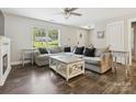 Bright living room with large windows, a ceiling fan and hardwood floors at 429 Summer Ridge Dr, Stanley, NC 28164