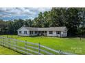 Inviting one-story home with a lovely front lawn and traditional architectural details at 4395 Burton Rd, Maiden, NC 28650