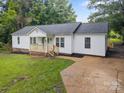 Charming single-story home with white siding, dark roof, front porch, and well-maintained landscaping at 442 Lovelace Rd, Rock Hill, SC 29730