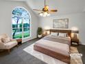 Spacious main bedroom with a large window, ceiling fan, and neutral carpet flooring at 4550 Briarcreek Rd, Maiden, NC 28650