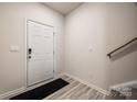 Clean entryway with light wood-look floors, white door, and neutral walls at 522 Trading Post Ln, York, SC 29745