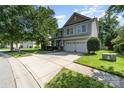 Beautiful two-story home boasting a well-maintained lawn and a spacious two-car garage at 10237 Broken Stone Ct, Charlotte, NC 28214