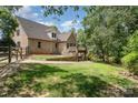 Large backyard featuring a deck and mature trees offering privacy at 135 Oak Creek Dr, Rockwell, NC 28138