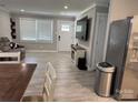 Spacious living room with open layout, hardwood flooring, neutral walls, and stainless steel appliances at 232 Harmony Hills Dr, Catawba, SC 29704
