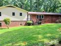 Lawn with a view of the home's brick and siding exterior, with stairs to the back entrance at 237 Antietam Rd, Statesville, NC 28625
