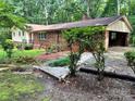 Side view of home featuring siding and brick exterior with an open carport at 237 Antietam Rd, Statesville, NC 28625