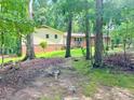 Exterior of home showing siding and brick nestled amongst mature trees at 237 Antietam Rd, Statesville, NC 28625