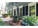 Close-up of a home's front entrance showcasing a manicured landscape and inviting entryway at 3008 Heathcroft Ct, Charlotte, NC 28269