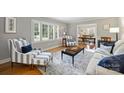 Bright living room with large windows, hardwood floors, and elegant furnishings at 3504 Mountainbrook Rd, Charlotte, NC 28210