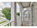 Inviting outdoor balcony showing neighborhood street and manicured landscaping at 402 Belton St, Charlotte, NC 28209