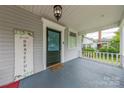 Inviting porch with decorative railing, patterned door, and a cozy, welcoming ambiance at 119 Foote St, Chester, SC 29706