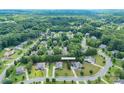 This aerial view showcases the neighborhood's layout and the lush greenery that surrounds the property at 11922 Kimberfield Rd, Matthews, NC 28105