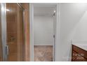 Bathroom featuring a glass-enclosed shower and neutral tile at 11965 Hambright Rd, Huntersville, NC 28078