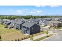 Spacious backyard and neighborhood view showcasing well-maintained homes and landscaping at 12205 Hollinhope Dr, Charlotte, NC 28278