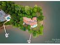Aerial view of an expansive lakefront property with mature trees and private dock access at 173 Rehoboth Ln, Mooresville, NC 28117
