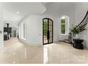 Elegant foyer featuring a grand staircase, marble floors, and designer finishes at 173 Rehoboth Ln, Mooresville, NC 28117