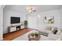 Bright living room features modern decor, hardwood floors, and plenty of natural light at 218 Water Oak Dr, Pineville, NC 28134