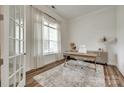 Well-lit office with a large window, sheer curtains, and modern desk setup at 2324 Loire Valley Dr, Indian Land, SC 29707