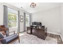 Bright office with natural light, wood floors, a modern desk, and stylish decor at 2732 Berkhamstead Cir, Concord, NC 28027