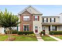 Charming townhome featuring a brick facade and a neatly landscaped front yard at 3247 Mannington Dr, Charlotte, NC 28270