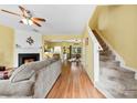 Inviting living room featuring a fireplace and an adjacent dining area, creating an open flow at 3247 Mannington Dr, Charlotte, NC 28270
