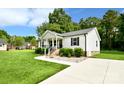 Charming single-story home with manicured lawn, concrete driveway, and inviting curb appeal at 339 Brown Rd, China Grove, NC 28023