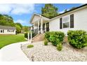 Inviting front yard with white stone landscaping and attractive greenery at 339 Brown Rd, China Grove, NC 28023