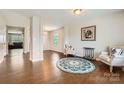 Open concept living room boasting hardwood floors, neutral paint, and an inviting atmosphere at 4151 Granite St, Midland, NC 28107