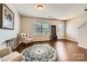 Cozy living room featuring hardwood floors, natural light, and comfortable seating arrangements at 4151 Granite St, Midland, NC 28107