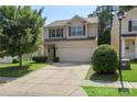 Charming two-story home with a well-manicured lawn and a two-car garage at 858 Rook Rd, Charlotte, NC 28216