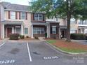Inviting townhome complex with well-maintained landscaping and ample parking spaces at 8838 Wandering Creek Way, Charlotte, NC 28227