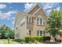 Charming two-story home with brick and siding exterior and manicured landscaping at 9001 Lanark Ln, Fort Mill, SC 29707